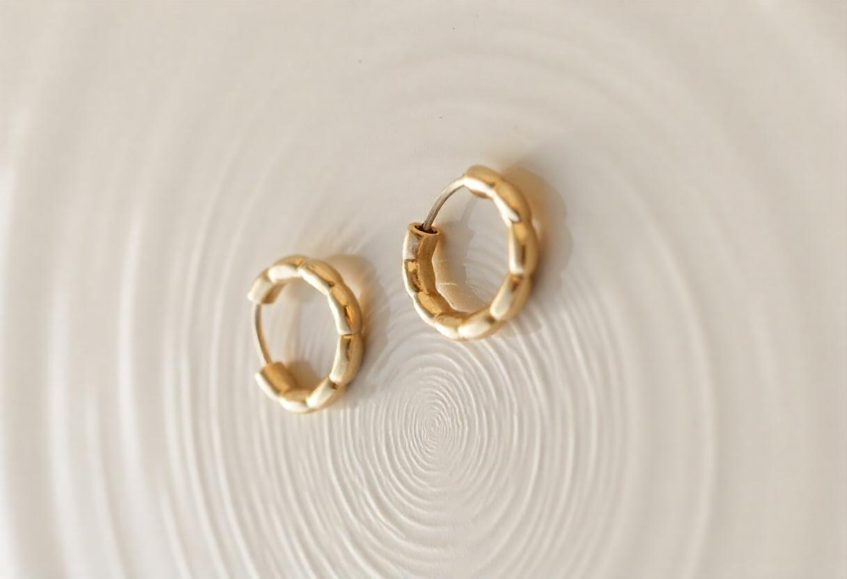 freepik__two-golden-earrings-on-a-rough-surface-with-water-__48700 freepik__two-golden-earrings-on-a-rough-surface-with-water-__48700